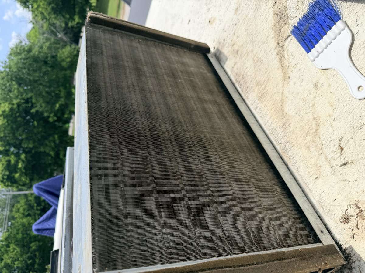 RV air conditioner condenser coil after Bud's deep cleaning service — clean and clear